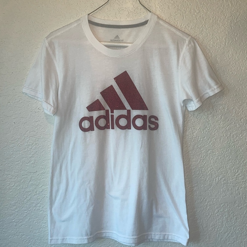 Adidas tshirt. Logo is maroon color with sparkles